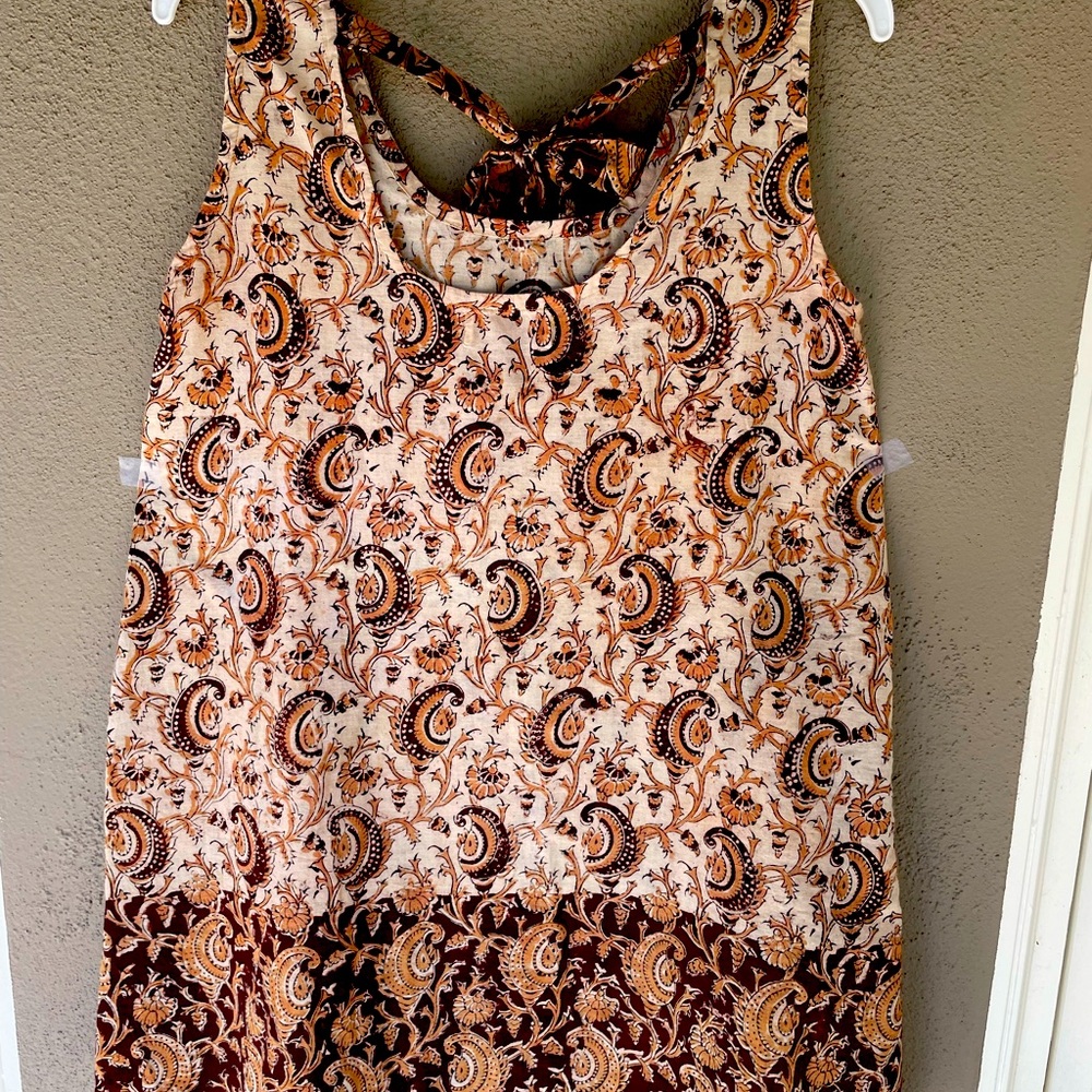 Light summer top with flattering tie across back.